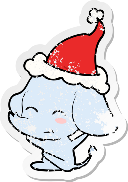 Sevimli el, insan tarafından çizilmiş Noel Baba şapkası giymiş bir fil çıkartması çizmiş.