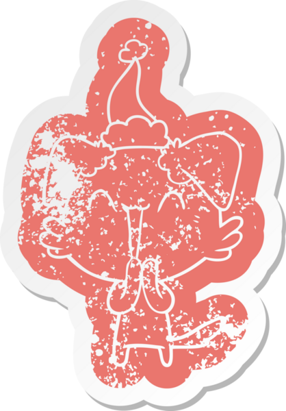 Gülen küçük köpek çizgi filmi bir insan tarafından çizilmiş Noel Baba şapkasının çıkartması.