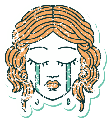 Bir insan tarafından çizilmiş ağlayan kadın yüzünün sembolik dövmeli görüntüsü.