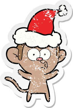 Bir insan tarafından çizilmiş Noel Baba şapkası giymiş şaşırmış bir maymunun el çizimi karikatürü.
