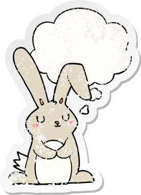 Düşünce baloncuğu olan çizgi film tavşanı insan tarafından çizilmiş yıpranmış bir çıkartma.