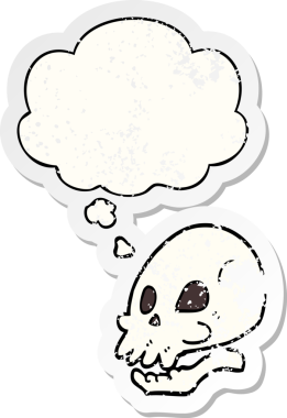 Düşünce baloncuklu karikatür kafatası bir insan tarafından çizilmiş yıpranmış bir çıkartma gibi.