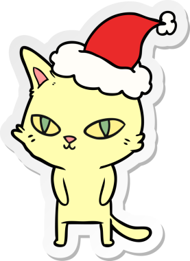 Bir insan tarafından çizilmiş Noel Baba şapkası takan parlak gözlü bir kedinin el yazısı.