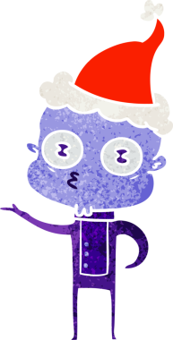 Bir insan tarafından çizilmiş Noel Baba şapkası giymiş garip kel bir uzaylının el çizimi karikatürü.