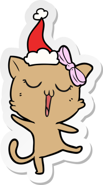 Bir insan tarafından çizilmiş Noel Baba şapkası takan bir kedinin el yazısı.