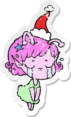 Bir insan tarafından çizilmiş Noel Baba şapkası takan ağlayan uzaylı bir kızın el yazısı.