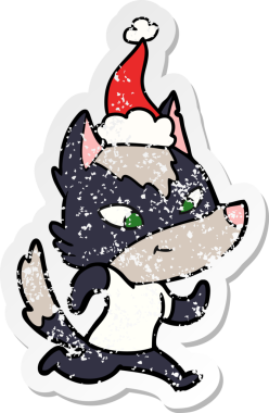Dost canlısı el, bir insan tarafından çizilmiş Noel Baba şapkası takan bir kurt çıkartması çizmiş.