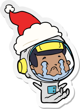 Bir insan tarafından çizilmiş Noel Baba şapkası giyen ağlayan bir astronotun el yazısı.