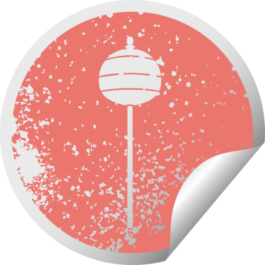 Sıkıntılı dairesel kabuk soyma etiketi bir insan tarafından çizilmiş altın bir sembol.