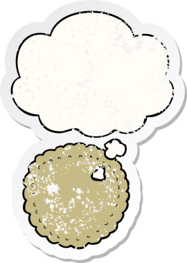 Düşünce baloncuklu çizgi film bisküvisi insan tarafından çizilmiş yıpranmış bir çıkartma.