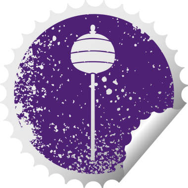 Sıkıntılı dairesel kabuk soyma etiketi bir insan tarafından çizilmiş altın bir sembol.