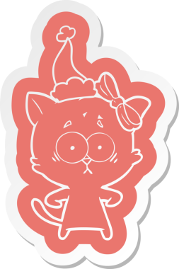 Bir insan tarafından çizilmiş Noel Baba şapkası takan bir kedinin garip karikatür çıkartması.