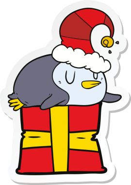 Bir insan tarafından çizilmiş Noel şapkası takan penguen karikatürü çıkartması.