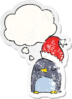 Düşünce baloncuğu olan sevimli noel pengueni insan tarafından çizilmiş yıpranmış bir çıkartma.