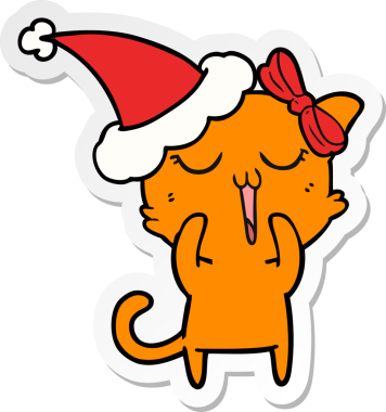 Bir insan tarafından çizilmiş Noel Baba şapkası takan bir kedinin el yazısı.