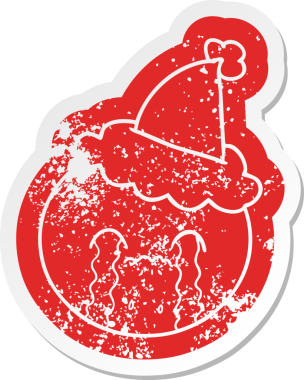 Bir insanın çizdiği noel baba şapkası takan portakallı bir karikatür.