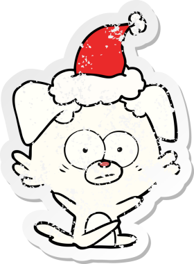 Sinirli köpek eli, bir insan tarafından çizilmiş Noel Baba şapkasının çizilmiş çıkartması.