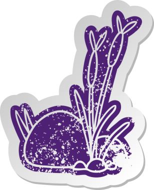 Bir insan tarafından çizilmiş taştan ve çakıldan oluşan eski bir karikatür çıkartması.