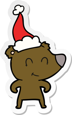 Kadın ayı eli, insan tarafından çizilmiş Noel Baba şapkasının çıkartmasını çizmiş.