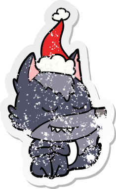 Dost canlısı el, bir insan tarafından çizilmiş Noel Baba şapkası takan bir kurt çıkartması çizmiş.