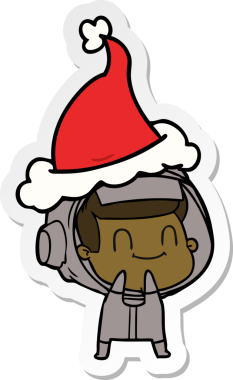 Bir insan tarafından çizilmiş Noel Baba şapkası giyen bir astronotun mutlu el çizimi karikatürü.