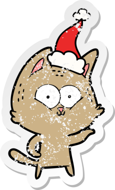 Bir insan tarafından çizilmiş Noel Baba şapkası takan bir kedinin çizilmiş el yazısı.