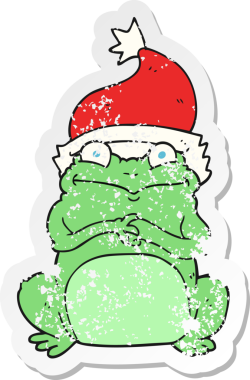 Bir insan tarafından çizilmiş noel şapkası giyen bir kurbağa çizgi film çıkartması.