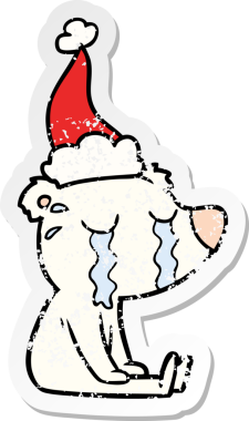 Ağlayan kutup ayısının bir insan tarafından çizilmiş Noel Baba şapkasıyla karikatürü.
