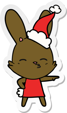 Bir insan tarafından çizilmiş Noel Baba şapkası giymiş garip bir tavşan eli çıkartması.