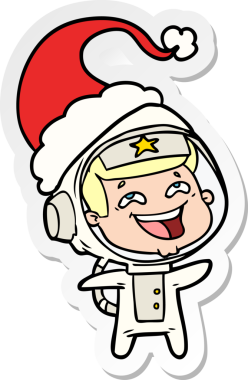 Bir insan tarafından çizilmiş Noel Baba şapkası giymiş gülen bir astronotun el yazısı.