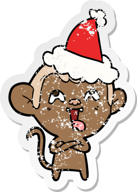 Çılgın el, insan tarafından çizilmiş Noel Baba şapkası takan bir maymunun sıkıntılı çıkartmasını çizdi.