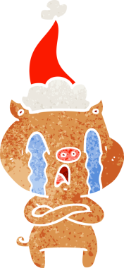 Ağlayan domuz eli bir insan tarafından çizilmiş Noel Baba şapkası çizilmiş.