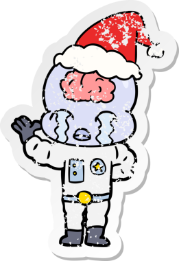 Bir insan tarafından çizilmiş Noel Baba şapkasıyla ağlayan büyük beyinli bir uzaylının el yazısı.
