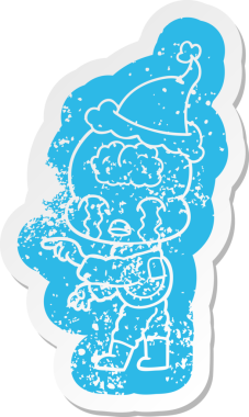 Büyük beyinli bir uzaylının ağlayan ve Noel Baba şapkası takan bir insan tarafından çizilmiş garip karikatür çıkartması.