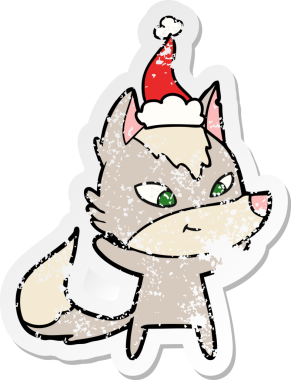 Dost canlısı el, bir insan tarafından çizilmiş Noel Baba şapkası takan bir kurt çıkartması çizmiş.