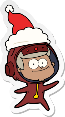 Mutlu astronot el çizimi bir insan tarafından çizilmiş Noel Baba şapkası.