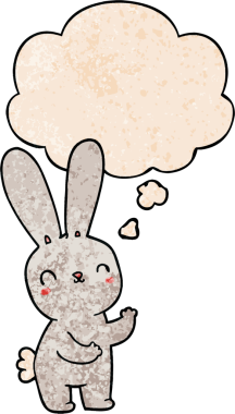 Bir insan tarafından çizilmiş grunge desenli düşünce baloncuklu şirin çizgi film tavşanı.