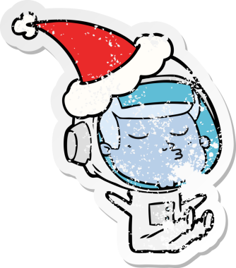 Bir insan tarafından çizilmiş Noel Baba şapkası giyen kendine güvenen bir astronotun sıkıntılı çıkartması.