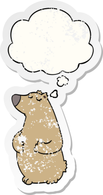 Düşünce baloncuğu olan çizgi film ayısı bir insan tarafından çizilmiş yıpranmış bir çıkartma.