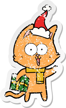 Komik bir el, bir insan tarafından çizilmiş Noel Baba şapkası takan bir kedi çıkartması çizmiş.