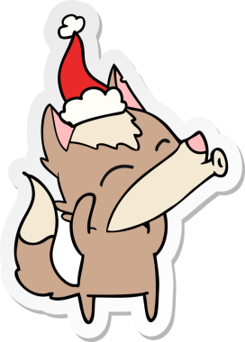 Uluyan kurt eli bir insan tarafından çizilmiş Noel Baba şapkasının çıkartması.