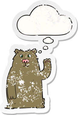 Düşünce baloncuğu olan çizgi film ayısı bir insan tarafından çizilmiş yıpranmış bir çıkartma.