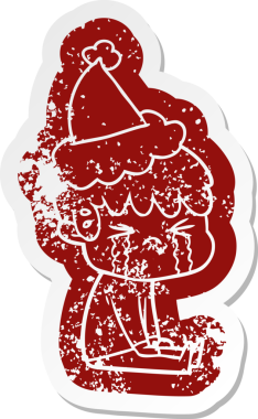 Garip bir çizgi film. Ağlayan bir çocuğun çıkartması. Bir insan tarafından çizilmiş Noel Baba şapkasıyla.