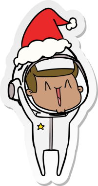 Bir insan tarafından çizilmiş Noel Baba şapkası giyen bir astronotun mutlu el çizimi karikatürü.