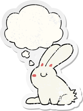 Düşünce baloncuğu olan çizgi film tavşanı insan tarafından çizilmiş yıpranmış bir çıkartma.