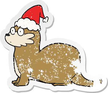 Bir insan tarafından çizilmiş Noel Baba şapkası giymiş bir su samurunun el çizimi çıkartması.