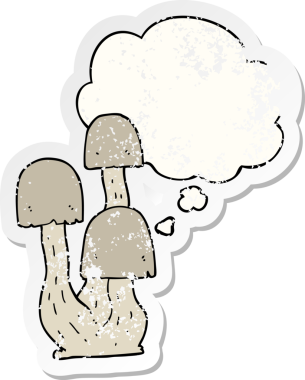 Düşünce baloncuğu olan karikatür mantarı insan tarafından çizilmiş yıpranmış bir çıkartma.