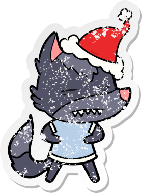 Bir insanın çizdiği Noel Baba şapkasıyla dişlerini gösteren bir kurt resmi.