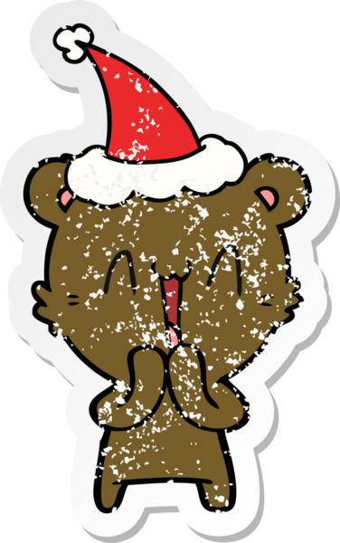 Mutlu ayı eli bir insan tarafından çizilmiş Noel Baba şapkasının sıkıntılı çıkartması.