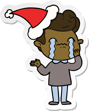 Bir insan tarafından çizilmiş Noel Baba şapkasıyla ağlayan bir adamın el yazısı.